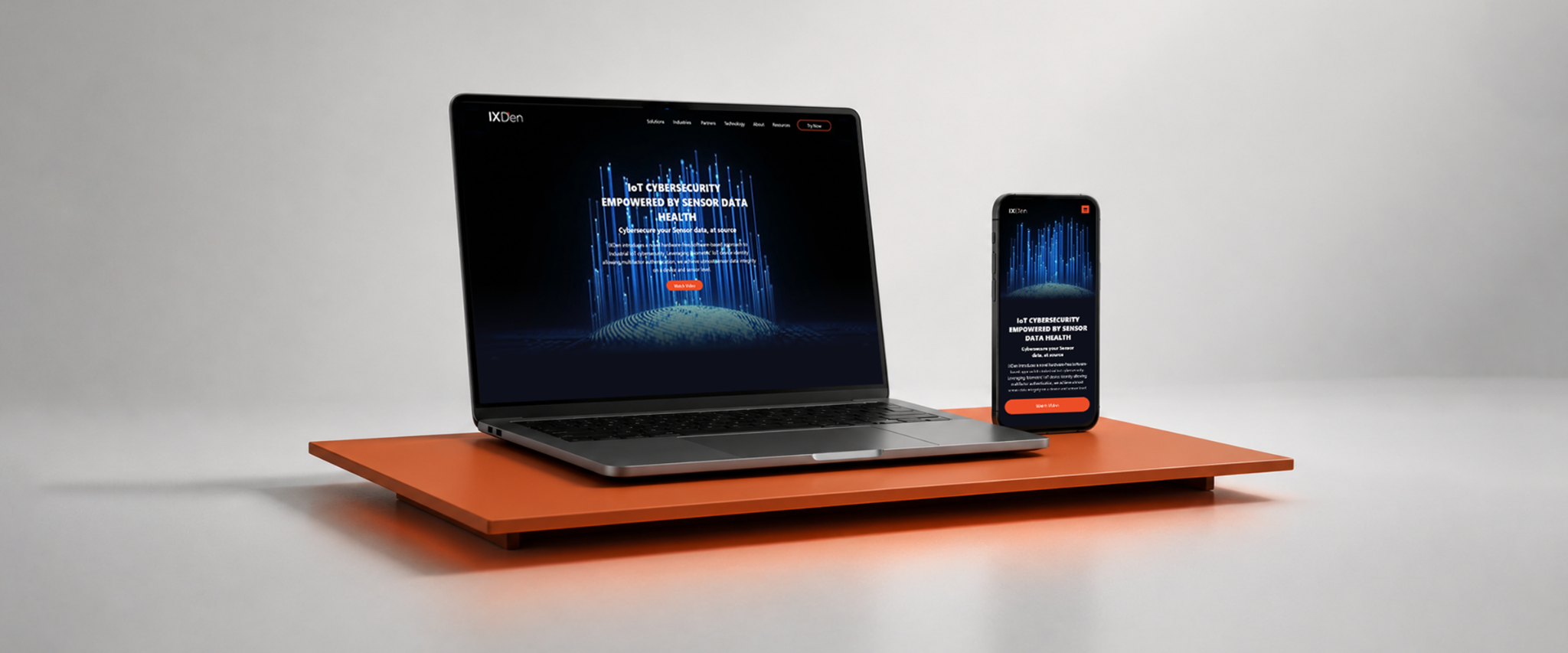 IXDen website shown on laptop and mobile